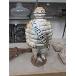 A cast iron Michelin man figure. 55.