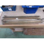 A quantity of brass stair rods