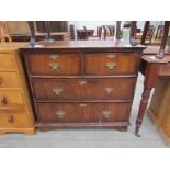 A Georgian walnut chest of two over two drawers