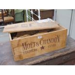 A Moet & Chandon pine champagne box containing empty straw wrapped bottles, with original receipt,