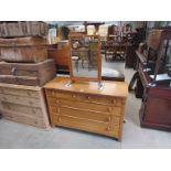 A medium oak chest of two over three drawers with mirror (mirror 66 x 50cm, chest 76cm high),