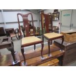 A pair of Edwardian Queen Anne style mahogany dining chairs