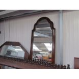 A 17th Century style figured walnut cushion frame bevel edge wall mirror,