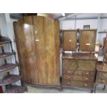 A 1930's Deco bedroom suite consisting of a two door wardrobe, dressing chest with stool,