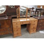 A walnut dressing table with mirror, made by Thorpe, Rose of York, North Yorkshire,