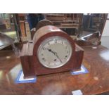 A 1930s oak three train mantel clock,