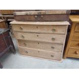 A 19th Century pine chest of four graduating drawers with brass ring handles