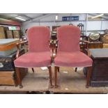 A pair of Georgian revival mahogany open armchairs on reeded legs