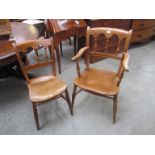 A set of two and three elm seated 19th Century Gothic back dining chairs