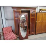 An Edwardian mahogany and string inlaid triple wardrobe, with central mirrored door, a/f,