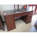 An Edwardian mahogany twin pedestal three section writing desk of nine drawers with brass swan neck