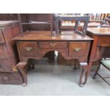 A Georgian revival oak lowboy with three drawers,