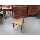 An Edwardian bedroom chair with rattan seat