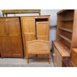 A walnut double wardrobe and pair of single bed ends made by Thorpe, Rose of York, North Yorkshire,