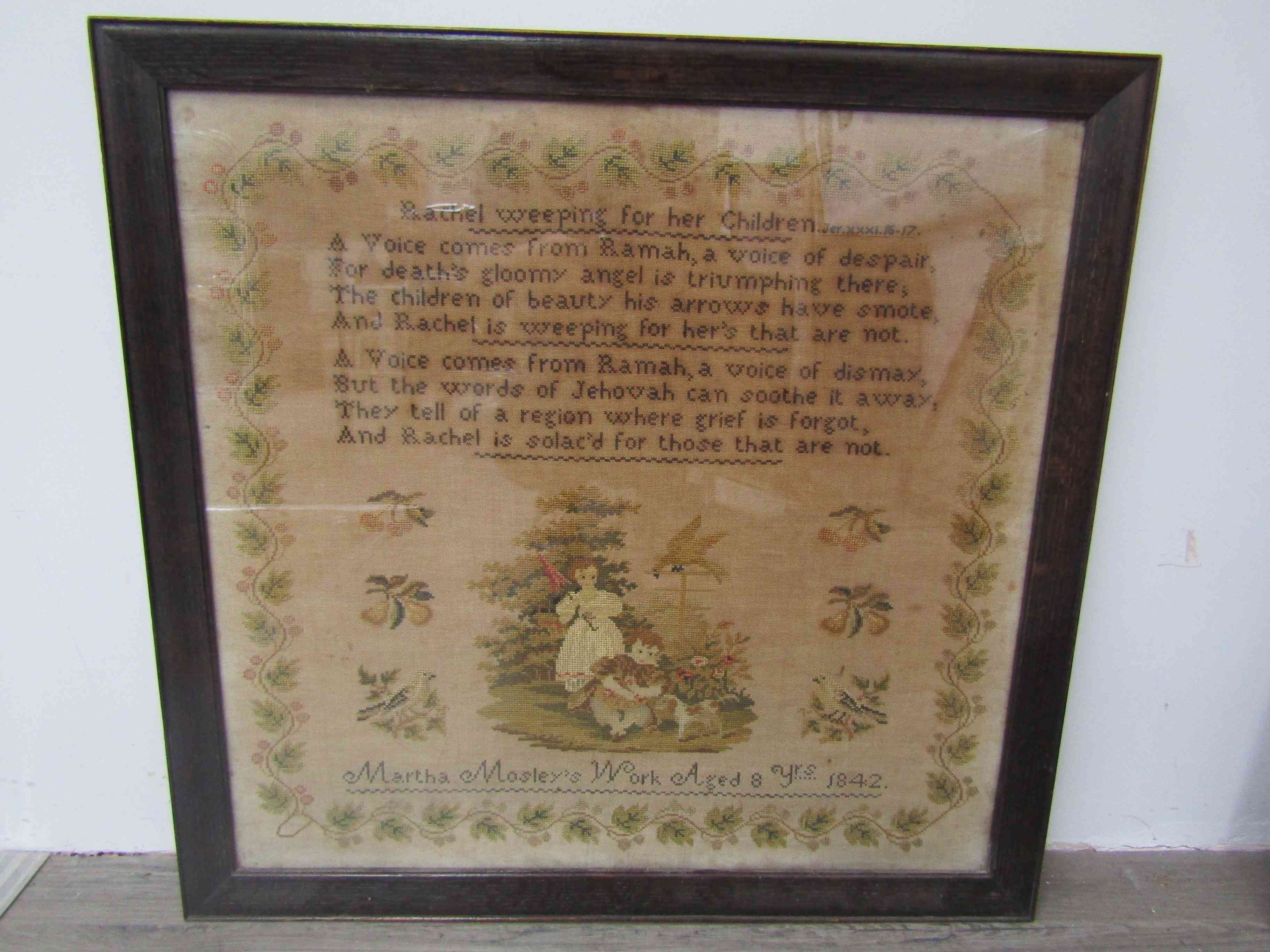 An early Victorian cross-stitch sampler worked in coloured silks on a canvas ground with two verses