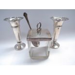 A silver lidded glass preserve jar of square form with a silver spoon and a pair of silver Walker