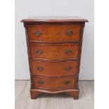A Georgian style crossbanded burr walnut serpentine front chest of small proportions