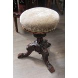 A Victorian stool with swivel top