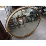 An oval ornate mirror, Art nouveau style,