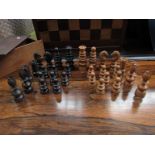 A Calvert wooden chess set with turned and carved pieces,