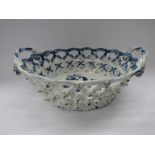 A Lowestoft porcelain blue and white "Pinecone" pattern scalloped oval chestnut basket with twisted