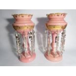 A pair of Victorian lustre's, gilt enriched pink glass with crystal glass droplets,