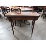 A Regency mahogany card table with canted corners, 74cm tall, 89.