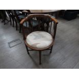 An Edwardian mahogany corner chair with modern upholstered seat