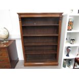 An early 20th Century oak floor-standing bookcase with four adjustable shelves. 151.5cm tall. 106.