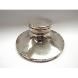 A William Neale silver capstan inkwell, Birmingham 1925, some small dents present,