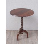 An 18th Century style oak wine table the circular top on barley twist column and umbrella shape