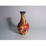 A Moorcroft Emma Bossons designed vase with poppy design,