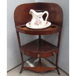 A mahogany corner washstand with single drawer and shaped undertier,