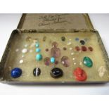 A collection of loose gemstones including Intaglio amethyst, turquoise, opals,