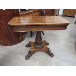 A William IV rosewood tea table with folding swivel top,