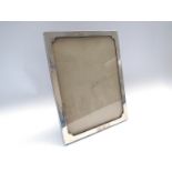 A Sanders & Mackenzie silver framed easel back photograph frame, 17cm x 22cm,