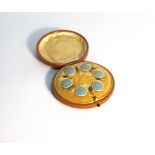 A vintage cased set of dress shirt buttons,