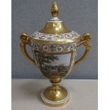 A classical lidded urn with flami-form knop decorated heavily in gilt with coloured cartouches of a