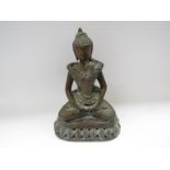 A deity figure, seated cross-legged with child on her lap,
