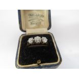 A gold three stone diamond ring 1ct total approx, stamped 18ct. Size L, 2.
