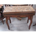 An early 20th Century hardwood games table,