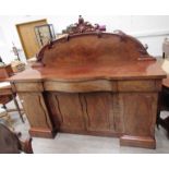 A Victorian mahogany twin-pedestal sideboard, shaped back with cellerette drawer.