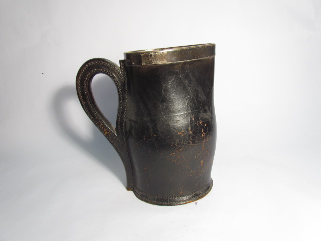 A Jacob & Ross of Winchester black leather jug with silver rim, Sheffield 1904,