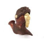 A carved wood figural smoking pipe with meerschaum bearded face