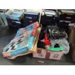 A box of vintage Kader slot car racing track etc