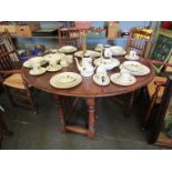 A Georgian style oak gateleg dining table,