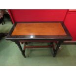 A Victorian walnut and ebonised ecclesiastical movement card table on turned legs