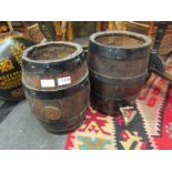 Two coopered oak kegs,