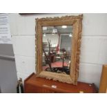 A carved oak wall mirror