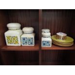 A selection of 1970's kitchenalia including graduating lidded storage jars (one a/f) and dishes